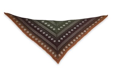 Triangular crochet shawl with green-to-brown ombre and lace eyelet motifs