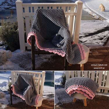 Gehäkelte graue Decke mit rosa Muschelrand auf Stuhl vor verschneiter Terrasse