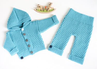 Flat-lay reference of a crochet baby hooded jacket with buttons and matching textured pants in turquoise