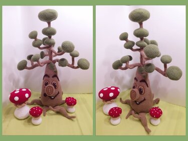Gehäkelter Baum mit Gesicht und roten Pilzen