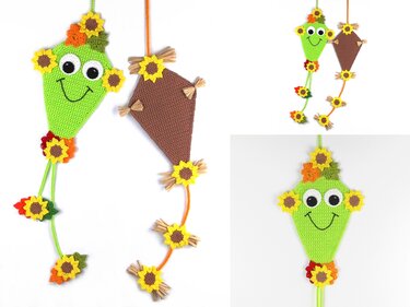 Pair of crocheted kite-shaped hangings with sunflower appliqués, one green smiling kite and one brown kite with tassel tails