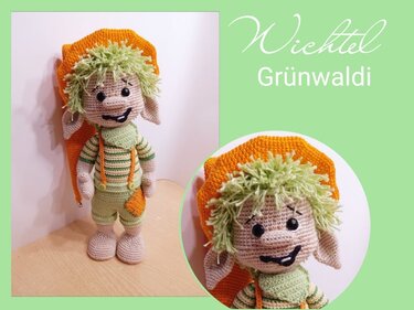 Gehäkelter Amigurumi-Wichtel mit grünem Garnhaar und orangefarbener Zipfelmütze
