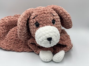 Plush crochet puppy snuggle blanket with floppy ears, white muzzle and paws