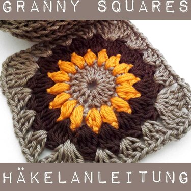 Gehäkeltes Granny Square mit orangefarbenem Blütenzentrum und braun-beigen Rändern