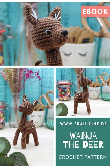 Braunes gehäkeltes Amigurumi-Reh mit weißen Tupfen auf Bastelarbeitsfläche