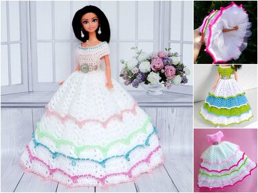 Doll wearing a long white crocheted dress with tiered pastel ruffles and bead trim, wearing pearl-style earrings and necklace.
