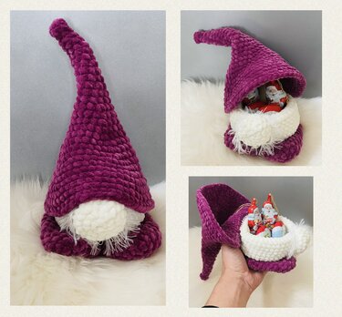 Gehäkelter Amigurumi-Wichtel in Magenta mit weißem Bart und offener Innenseite mit Schokoladenfiguren