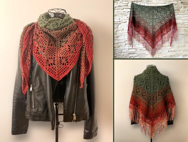 Triangle crochet shawl with green-to-red gradient, floral lace pattern and long fringe, draped on a mannequin and over a jacket