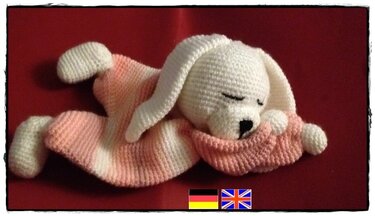 Pink striped crochet baby snuggle blanket with sleepy white head