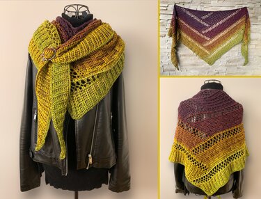 Triangle gradient crochet shawl draped on a mannequin and pinned
