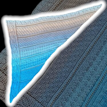 Triangular crochet shawl with cream-to-aqua ombré, textured panels, eyelet rows and braided border