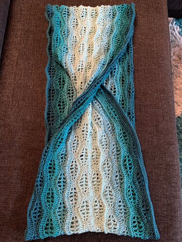 Teal-to-cream crocheted infinity cowl with leaf-lace stitch and center twist