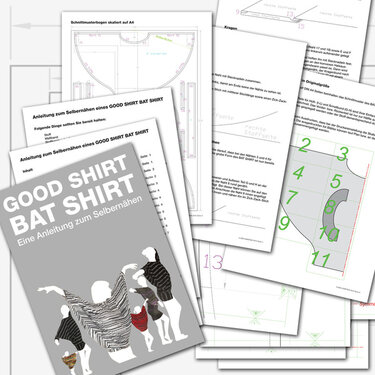 Mehrere ausgebreitete Schnittmusterbögen und eine Nähanleitung für ein Fledermausshirt