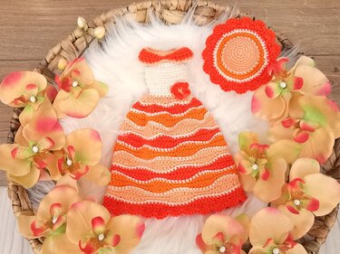Orange, peach and white crocheted amigurumi dress with scalloped hem and matching round hat