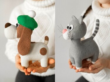 Two amigurumi toys: brown-and-white dog with green beret and grey cat held in hands.