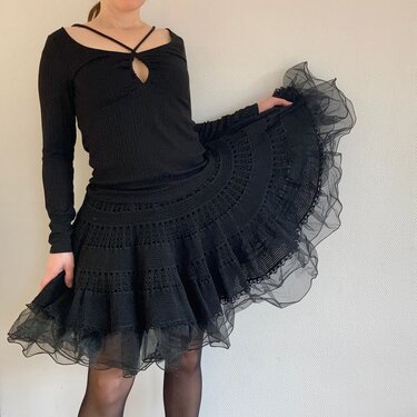 Black full-circle crochet skirt with scalloped stitch panels and sheer tulle trim