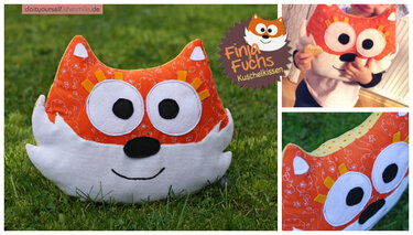 Fuchs-Kuschelkissen aus orangegemustertem Stoff mit weißer Schnauze und großen Applikationsaugen