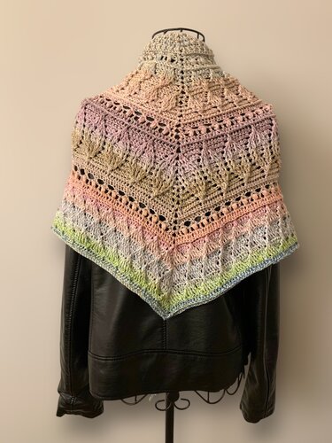 Banded lace triangle crochet shawl in pastel colors on a mannequin