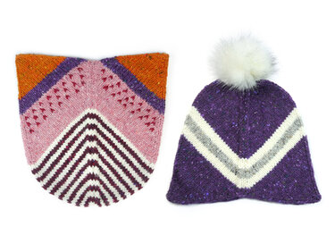 Purple knitted beanie with white pom-pom and white/gray chevron stripes beside a flat pink, orange and purple chevron knitted panel