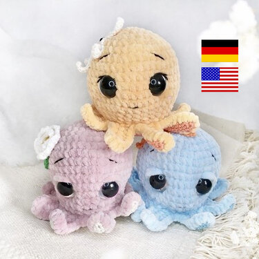 Three plush crocheted amigurumi octopuses in pastel peach, pink with a small white flower, and light blue.