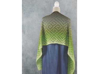 Back view of rectangular green ombré crochet shawl with diamond lace pattern on a mannequin
