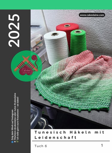 Tunisian crochet crescent shawl in green-to-red gradient draped on a table with three yarn cones