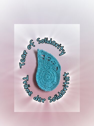 Turquoise crocheted teardrop motif with spiral center and three eyelets, labeled 'Tear of Solidarity'