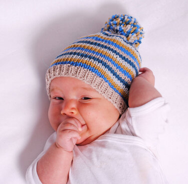 Strickanleitung Ringeldecke Karl & Co. in der Größe 55x72 cm, mit Mütze