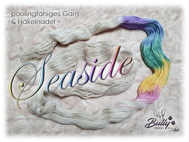 Garnstrang in Naturton mit buntem Regenbogenverlauf am Ende, Textaufdruck 'Seaside' und Hinweis 'poolingfähiges Garn & Häkelnadel', kleines Bully Design Logo in Ecke