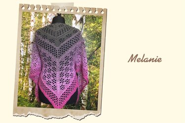 Grey-to-pink ombre crocheted triangle shawl with openwork lace displayed on a mannequin.