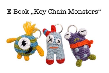 Three crocheted monster keychains in blue, gray, and purple with metal split rings; text above reads E-Book "Key Chain Monsters".