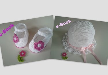 Weiße gehäkelte Babymütze mit Rüsche neben weißen Ballerinas mit rosa Blüte