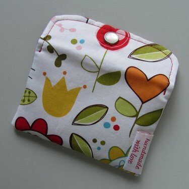 Floral fabric coin purse with metal snap and 'handmade with love' tag