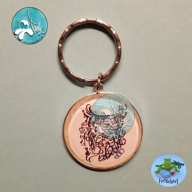 Glossy round keychain pendant with ornate owl line-art on pale pink background and metal split ring
