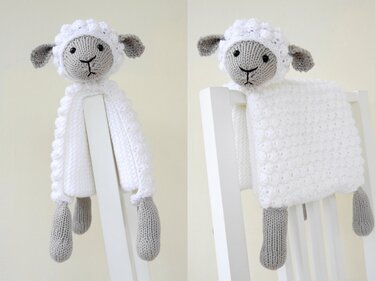 White knitted lamb lovey with grey head and dangling legs draped over a chair