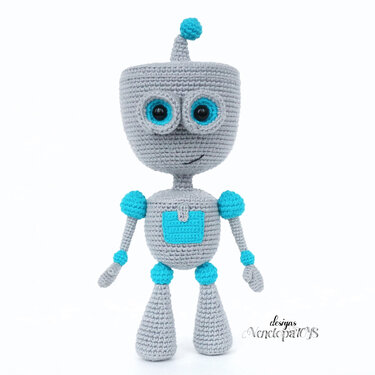 Crocheted grey robot amigurumi with turquoise eyes and accents on white background
