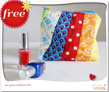 Kleines Reißverschluss-Mäppchen mit bunten Stoffstreifen, Vordergrund zeigt zwei Nagellackfläschchen als Größenhinweis