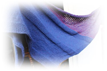 Close-up of blue knit scarf with textured stitches and thin red stripes