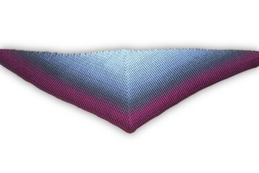 Crocheted triangle shawl with pale blue to magenta gradient