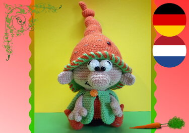 Gehäkelter Frühlingswichtel mit orange-grüner Kleidung vor gelbem Hintergrund