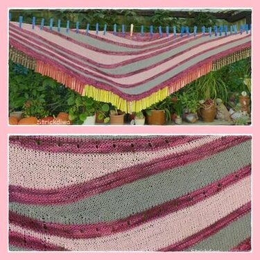 Gestricktes Dreieckstuch in Rosa- und Grautönen mit bunten Fransen, aufgehängt mit Wäscheklammern