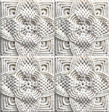 Nahaufnahme eines hellen gehäkelten Granny Squares mit erhabenem Blumen- oder Sternmuster