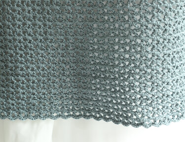 Teal open-lace crochet fabric with scalloped hem