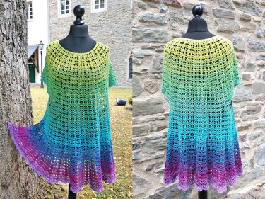 Front and back view of a rainbow ombre crocheted women's tunic with short sleeves and scalloped flared hem on a mannequin.