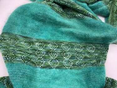 Turquoise knitted scarf with a variegated green diamond lace band