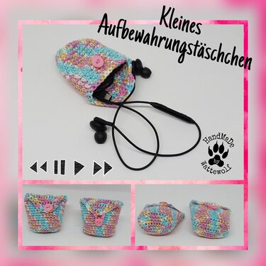 Offenes pastellfarbenes Häkel-Täschchen mit Knopf, Ohrhörer sind im Inneren sichtbar