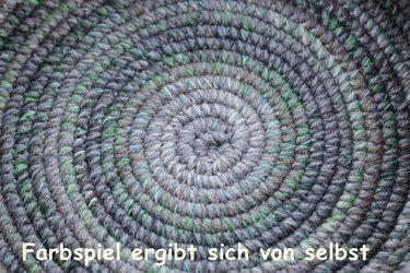 Macro view of stitch detail on round crochet basket base with variegated yarn