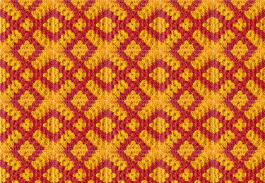 Wiederholendes gehäkeltes Granny-Square-Muster in Rot und Gelb mit diagonalen Rhomben