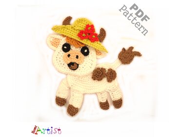 Crochet cow appliqué in cream and brown wearing a yellow sun hat with red flowers.