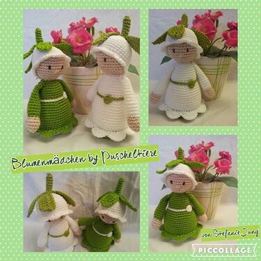 Zwei Amigurumi-Blumenmädchen (grün und weiß) mit Blütenhüten vor rosa Topfblumen